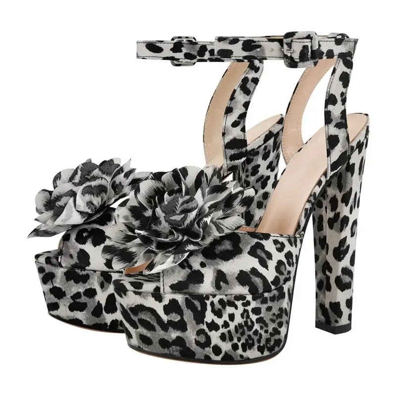 High heels for women in leopard print with floral embellishments, featuring a high platform and ankle strap.