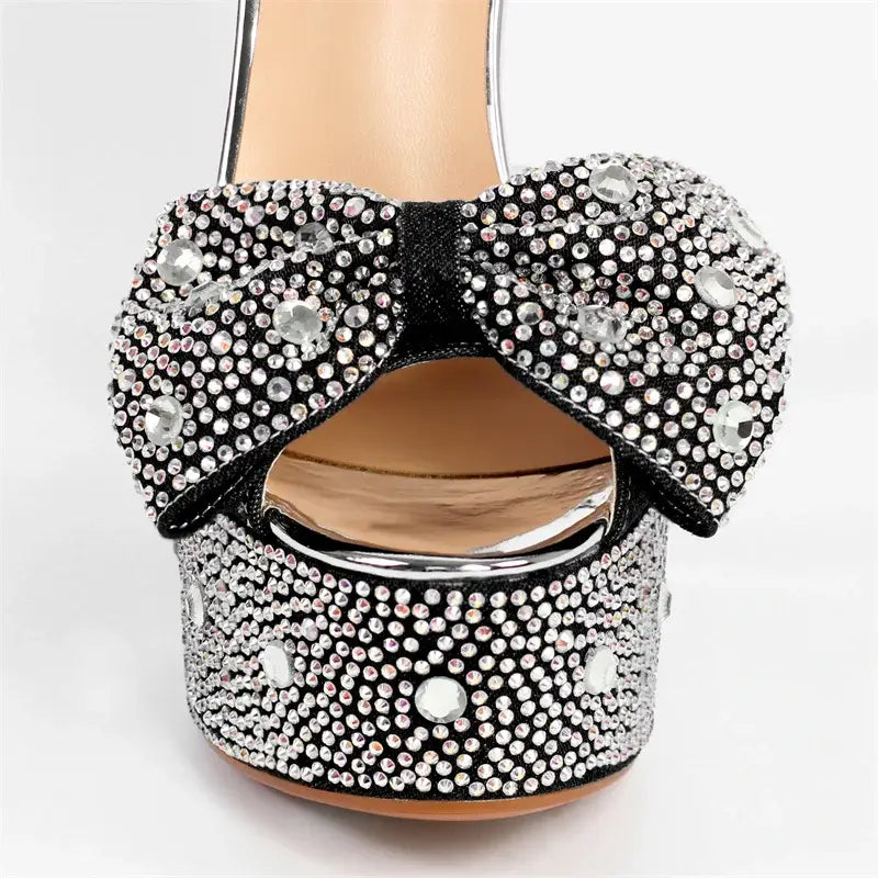 High-quality black platform heels with rhinestone decoration and bow detail, perfect for stylish women.