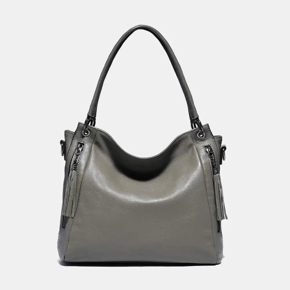 Shoulder hobo bag in gray, handmade leather with zipper details and tassel, stylish and spacious for women.