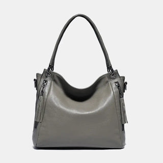 Shoulder hobo bag in gray, handmade leather with zipper details and tassel, stylish and spacious for women.