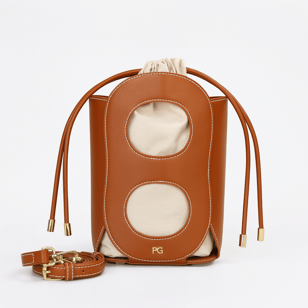 Hollow-out bucket bag in brown, elegant summer accessory with drawstring closure and canvas lining, Model P3117.