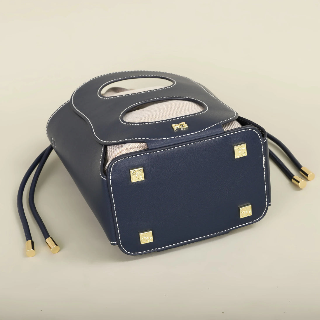 Navy hollow-out bucket bag, stylish canvas bag with geometric design, perfect for summer outings and beach days.