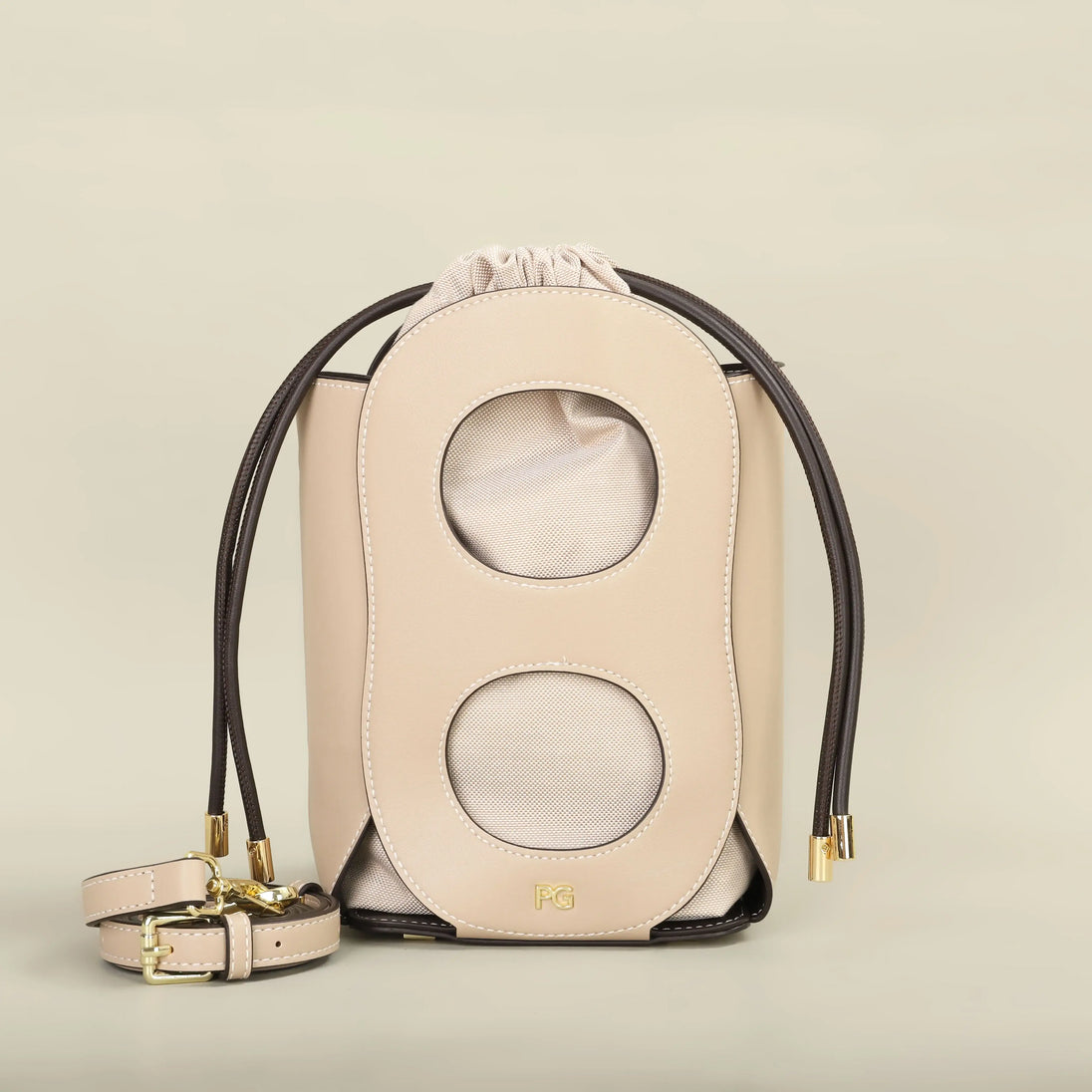 Stylish beige women's hollow-out bucket bag with geometric design, perfect for summer outings and casual wear.