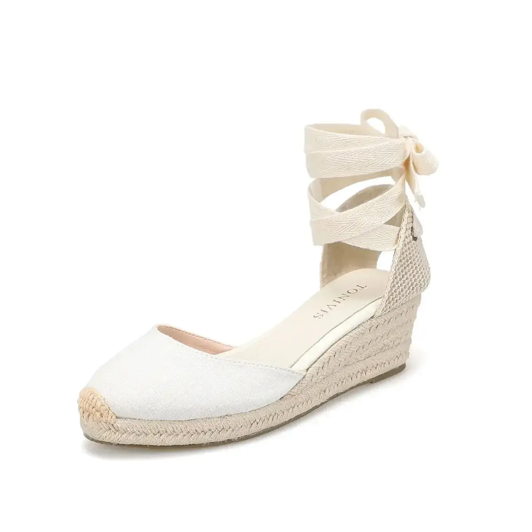 Espadrille sandals in cream color, featuring cross-strap design and wedge heel for casual summer wear.