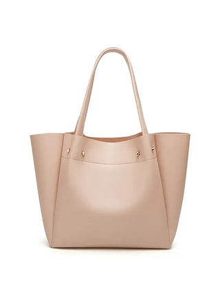 Women's large beige tote bag in faux leather, minimalist design, perfect for casual occasions.