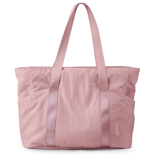 Large capacity light pink tote bag made of high-quality polyester for women, perfect for everyday use.