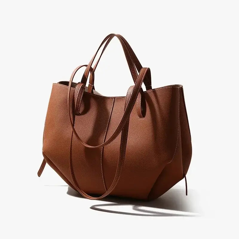 Genuine leather tote bag in brown, spacious design for daily use and high-end fashion.