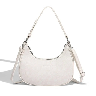 Pink half moon bag for women, stylish shoulder bag with tassel decoration and soft PU material.