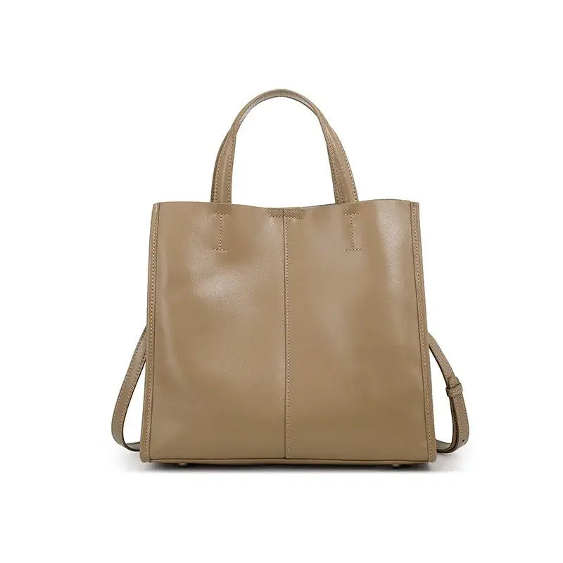 Structured beige leather handbag, versatile satchel ideal for casual and formal occasions, with elegance and practicality.