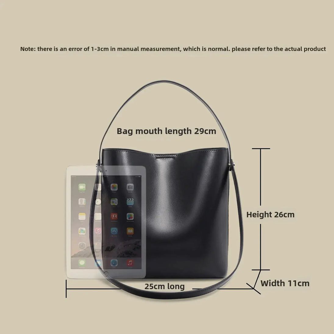 Brown leather shoulder bag with top handle and crossbody strap, featuring a minimalist design and large capacity.