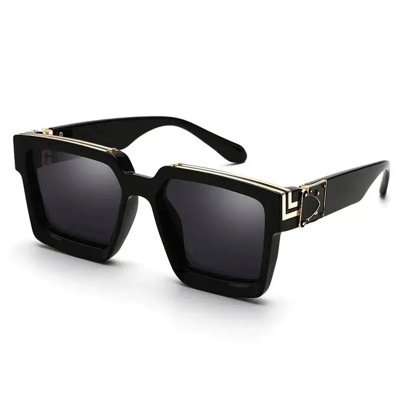 Women's oversized black square sunglasses with gold detail, trendy UV400 eyewear for outdoor use.