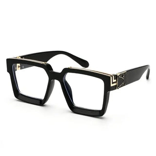Black oversized square sunglasses with gold detail, trendy and fashionable eyewear for outdoor use.