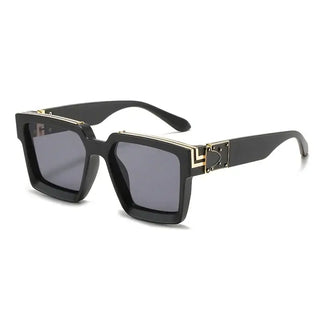 Women's oversized black square sunglasses with gold detail, trendy fashion eyewear for outdoor use.