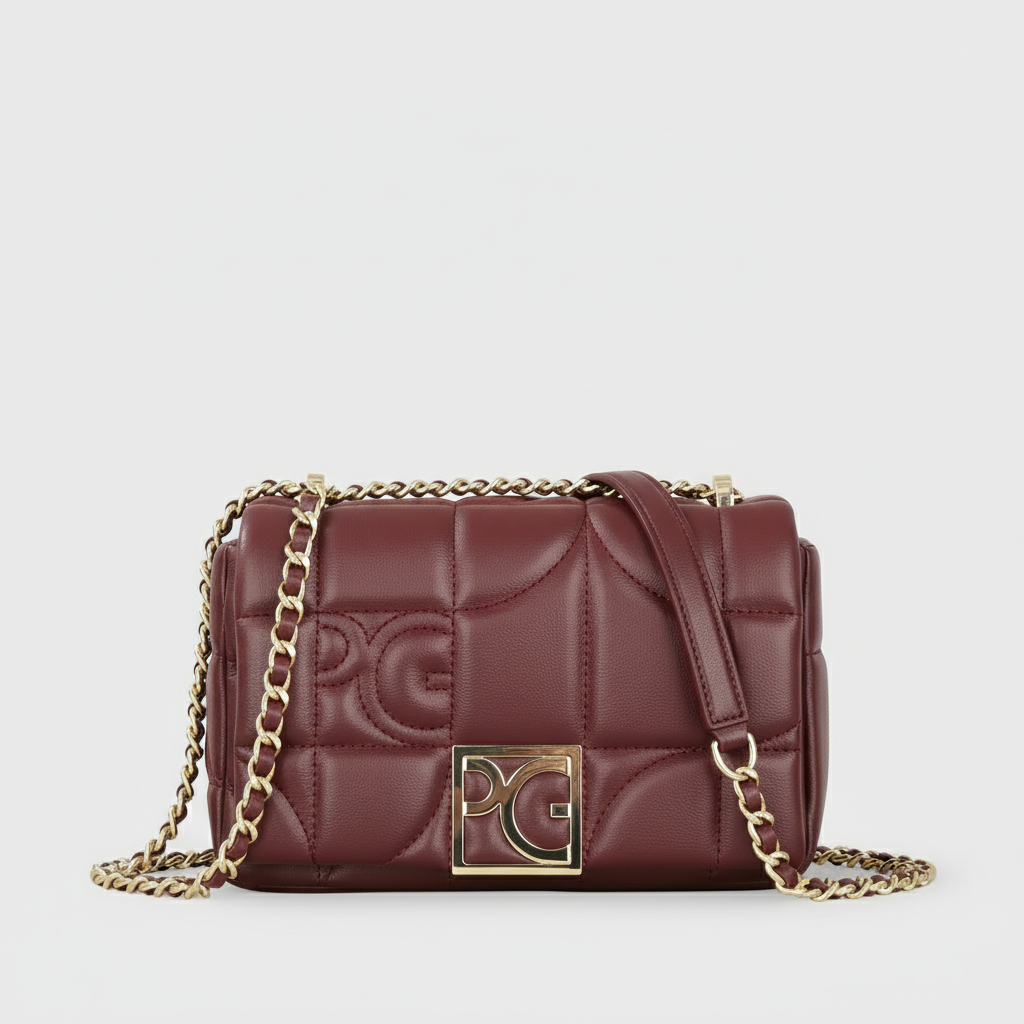 Burgundy quilted leather messenger bag with gold-tone chain strap and sleek square design.