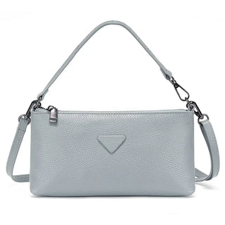 Shoulder bag in light gray leather, sleek design perfect for casual and formal occasions.