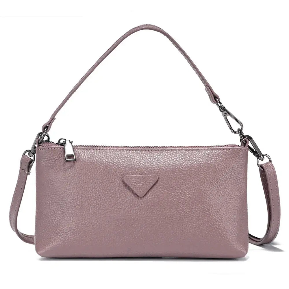 Shoulder bag in soft pink leather, sleek envelope style perfect for women, adds fashion-forward versatility to any outfit.
