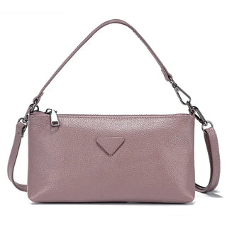 Shoulder bag in soft pink leather, sleek envelope style perfect for women, adds fashion-forward versatility to any outfit.
