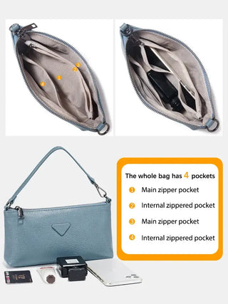 Shoulder bag leather in blue, featuring four pockets including main zippered and internal zippered pockets.