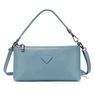 Blue leather shoulder bag with a sleek design, perfect for casual and formal occasions.