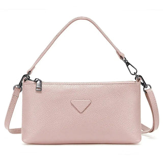 Shoulder bag, pink leather, women’s envelope-style bag with sleek design and silver accents.