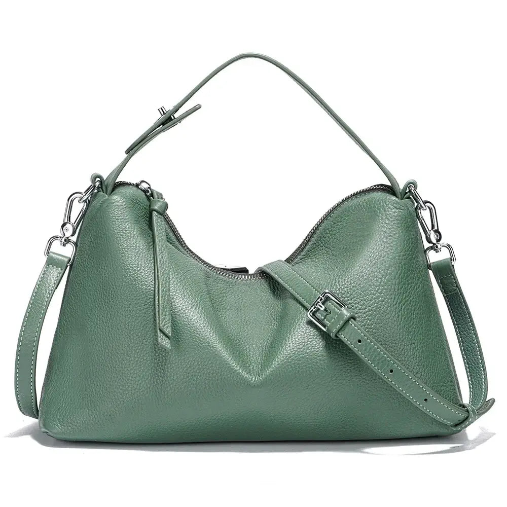 Green leather shoulder bag with adjustable strap, stylish design, and spacious interior for everyday essentials.