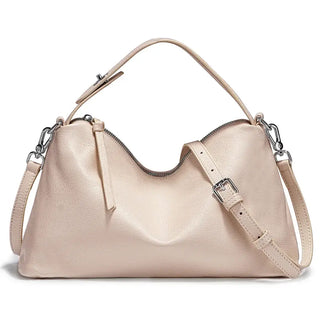 Leather shoulder bag in soft beige, stylish and versatile hobo design, perfect for carrying essentials.