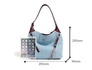 Light blue casual women's shoulder bag with brown leather strap, showcasing dimensions and style.