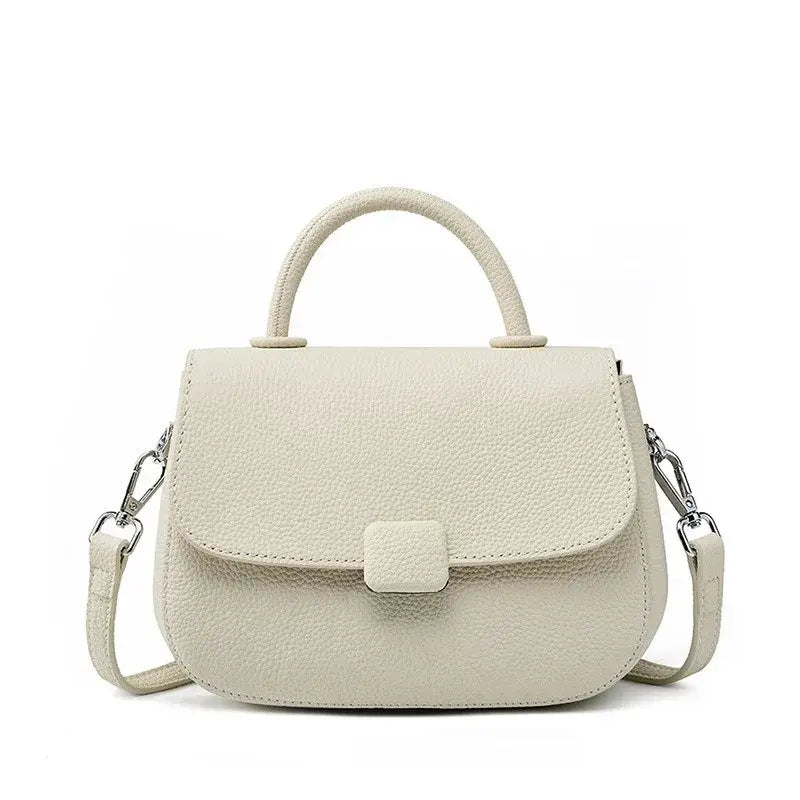 Soft leather shoulder bag in beige, stylish and practical design with secure zipper closure for organized essentials.