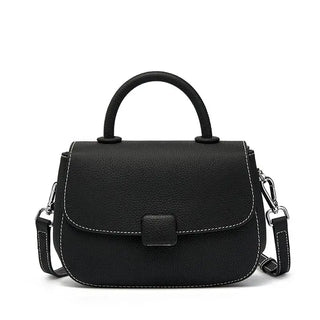 Black shoulder bag in soft leather, featuring a structured design and adjustable strap for versatile styling.