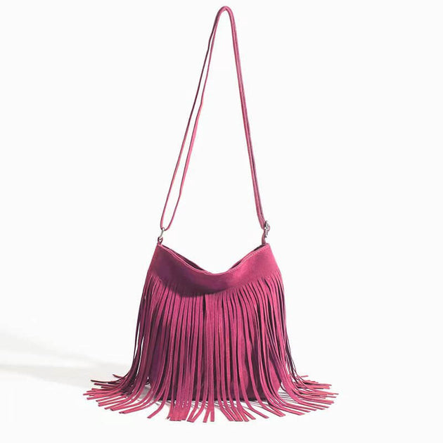 Fringe Crossbody Bag with stylish fringe design in a vibrant pink color, perfect for leisure travel.