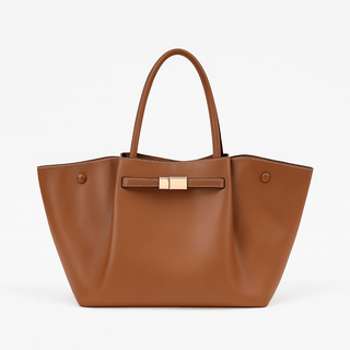 Tan faux leather tote bag with structured silhouette and gold-tone clasp, perfect for shopping and daily use.