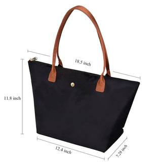 Green women’s tote bag with brown handles, zipper closure, stylish for parties, durable TPU material, large capacity.