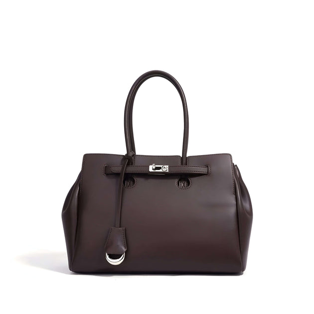 Dark brown leather women’s tote bag with top handles and silver lock detail, crafted from premium cowhide leather.