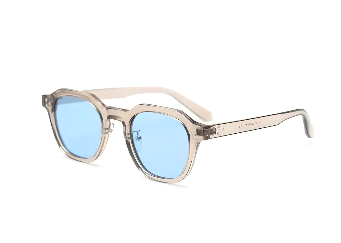 Women’s sunglasses in translucent frame with blue lenses, UV400 protection, unisex eyewear, perfect for outdoor use.