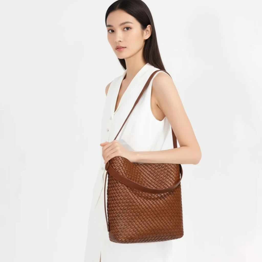Woven leather bag in brown, handmade with soft structure, perfect for summer style and casual elegance.