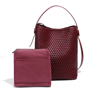 Woven leather bag in burgundy with matching pouch, chic design for summer style and everyday functionality.
