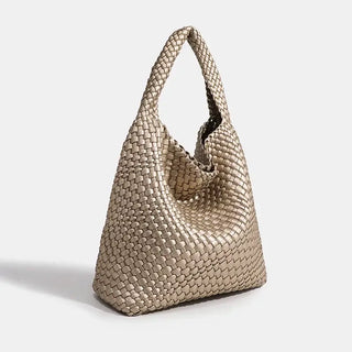 Woven shoulder bag in metallic gold, handmade tote bag with criss-cross design for stylish women.