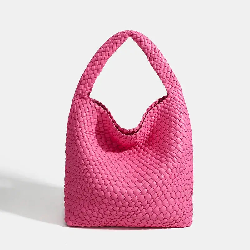 Woven shoulder bag in bright pink, handmade from durable materials, perfect for casual and stylish outings.