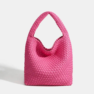 Woven shoulder bag in bright pink, handmade from durable materials, perfect for casual and stylish outings.
