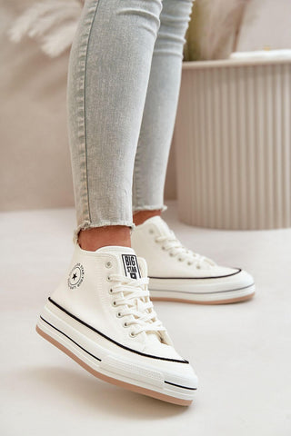 Women's sneakers from Big Star worn with light jeans, features a white design and a comfortable rubber sole.