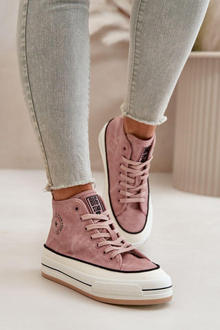 Women's sneakers in pink from Big Star worn with light blue jeans, showcasing comfort and style.