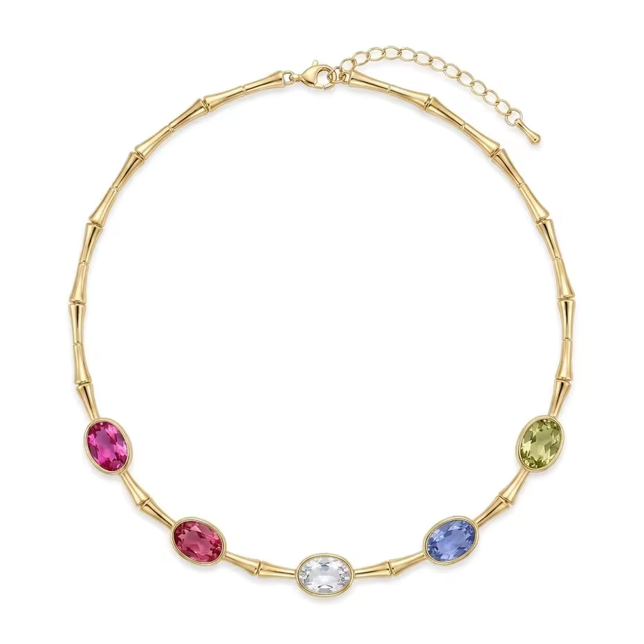Collana in bamboo dorato con cristalli ovali