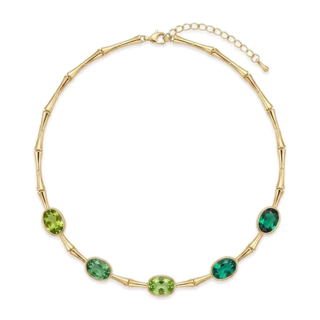Collana in bamboo dorato con cristalli ovali